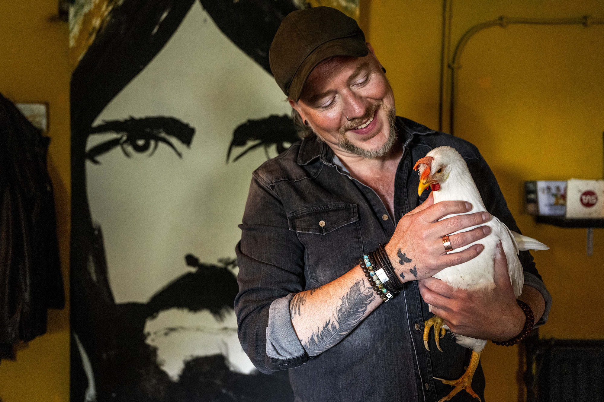 Xander Stok of Project of Love with his rescue chicken Snowy